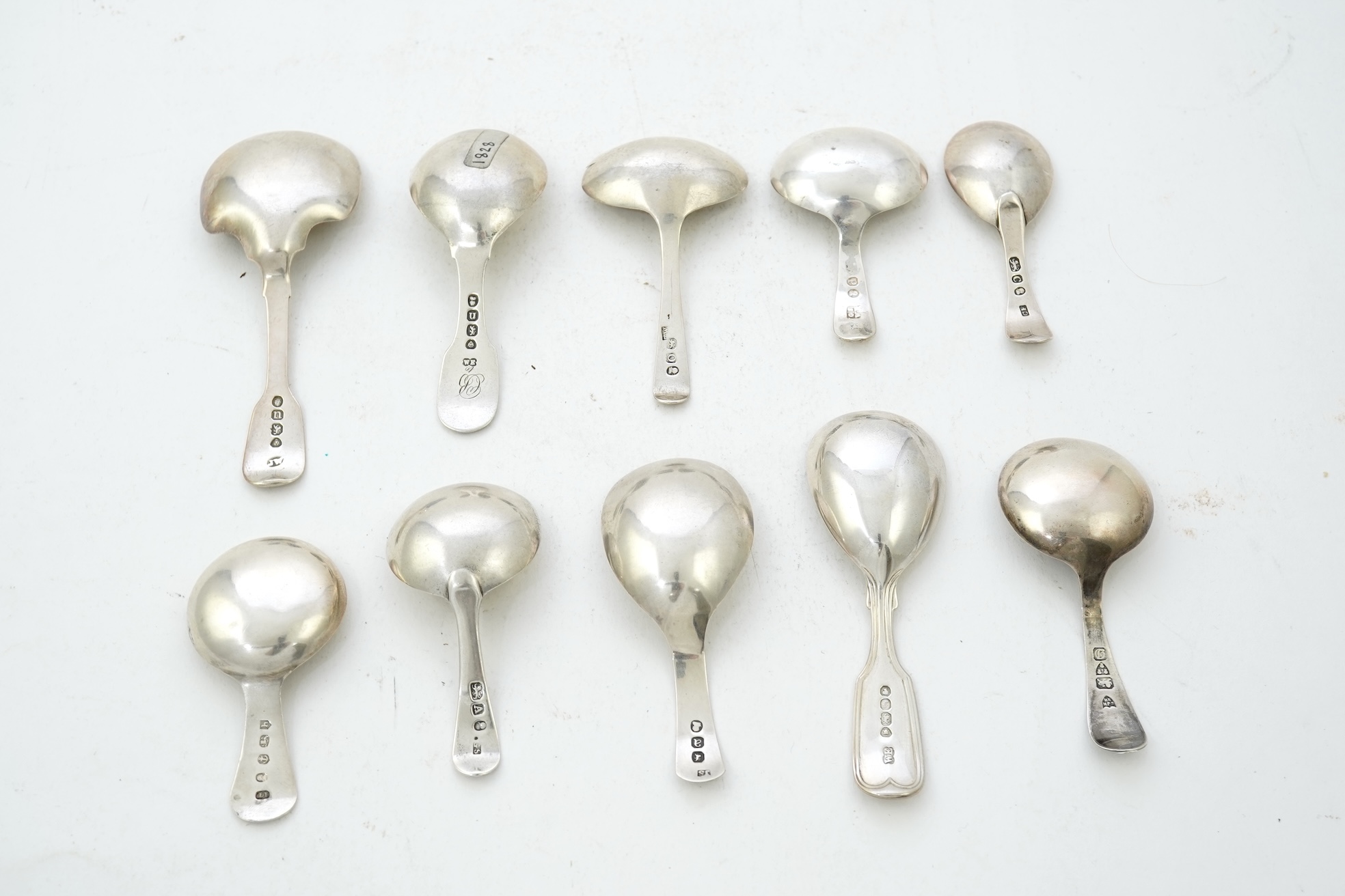 Ten assorted mainly 19th century silver caddy spoons, including seven Old English pattern, one fiddle pattern, one fiddle and thread pattern and one fiddle and shell pattern